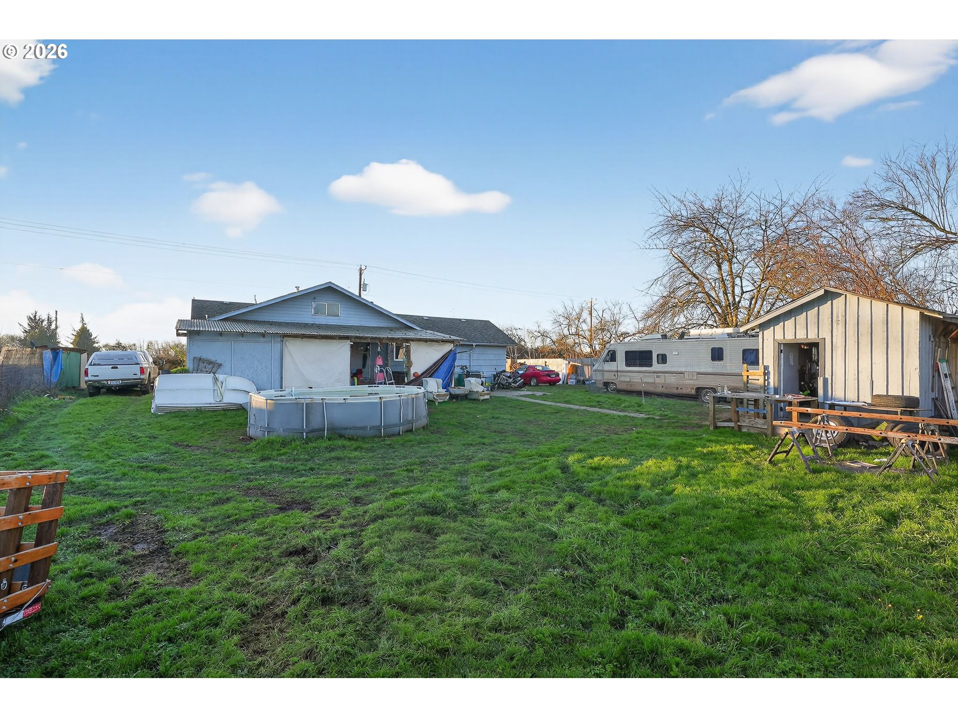 92981 Prairie Road Junction City, OR 97448 - Photo 27 of 29 a view of a house with a big yard potted plants and large tree