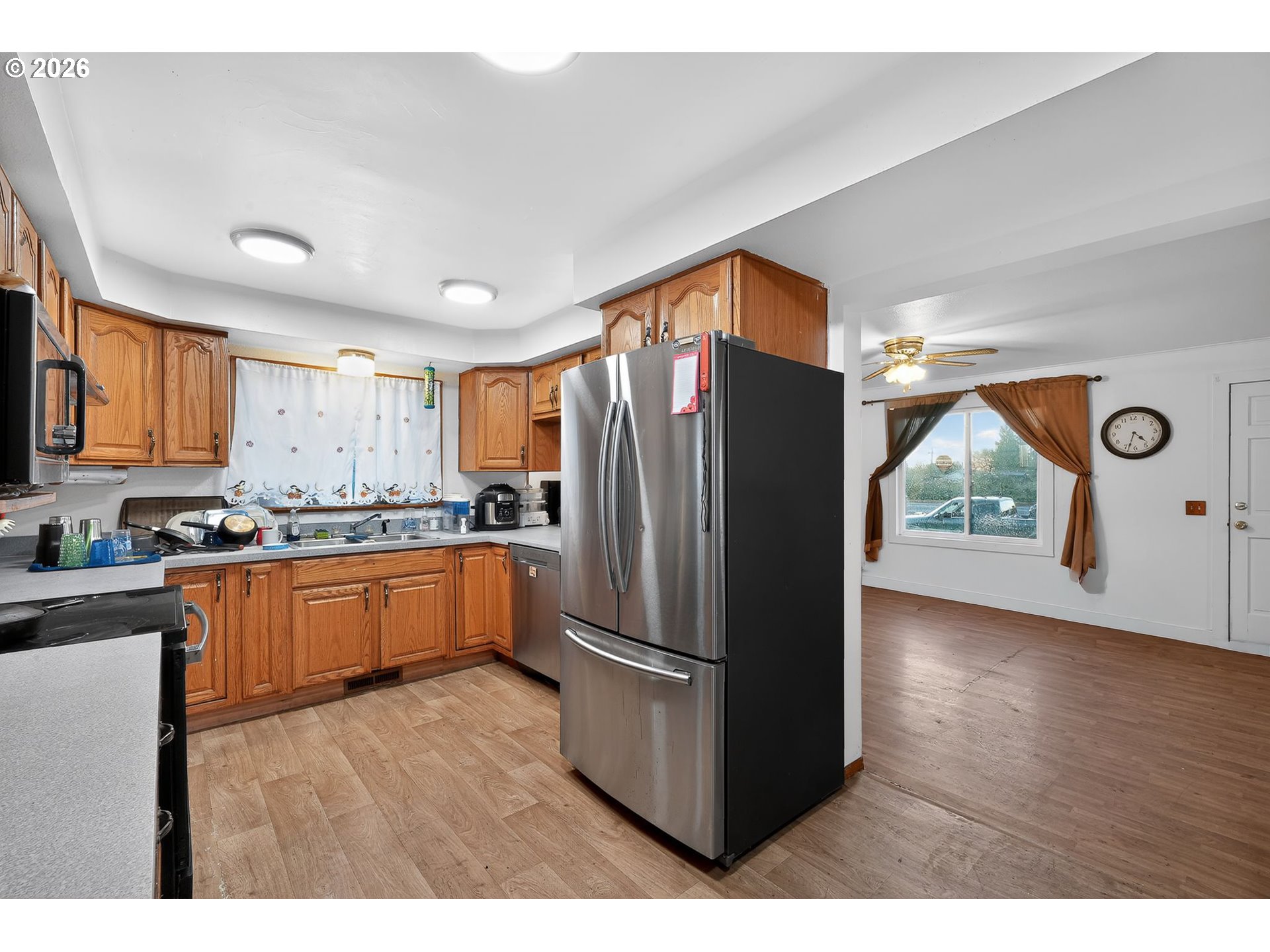 92981 Prairie Road Junction City, OR 97448 - Photo 9 of 29 a kitchen with stainless steel appliances granite countertop a refrigerator a sink and a stove