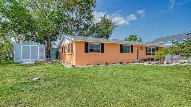 a backyard of a house with seating space