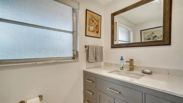 a bed room with a bed and a large window