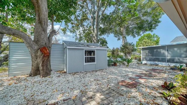 a view of a room with wooden floor and furniture