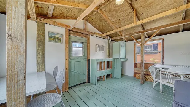 a front view of a house with a yard table and chairs