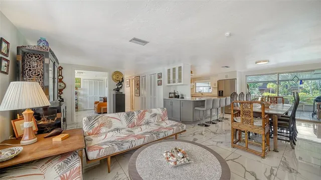 a living room with furniture and a table
