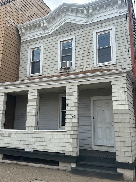 101 Avenue F, Unit 2 Bayonne, NJ 07002 - Photo 10 of 10 a view of a house with more windows and brick wall