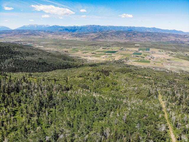 3090 North Rocky Road Kamas, UT 84036 - Photo 15 of 17 Aerial view of property and surrounding area with mountains