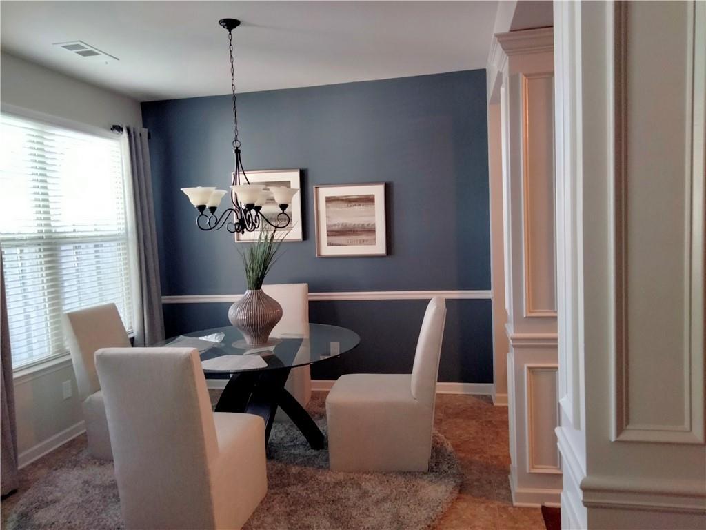 3144 Spicy Cedar Lane Lithonia, GA 30038 - Photo 5 of 18 a dining room with furniture and window
