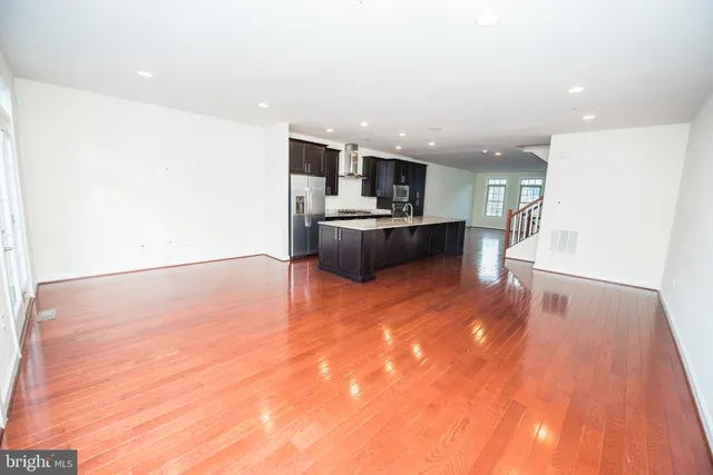 a view of kitchen with wooden floor