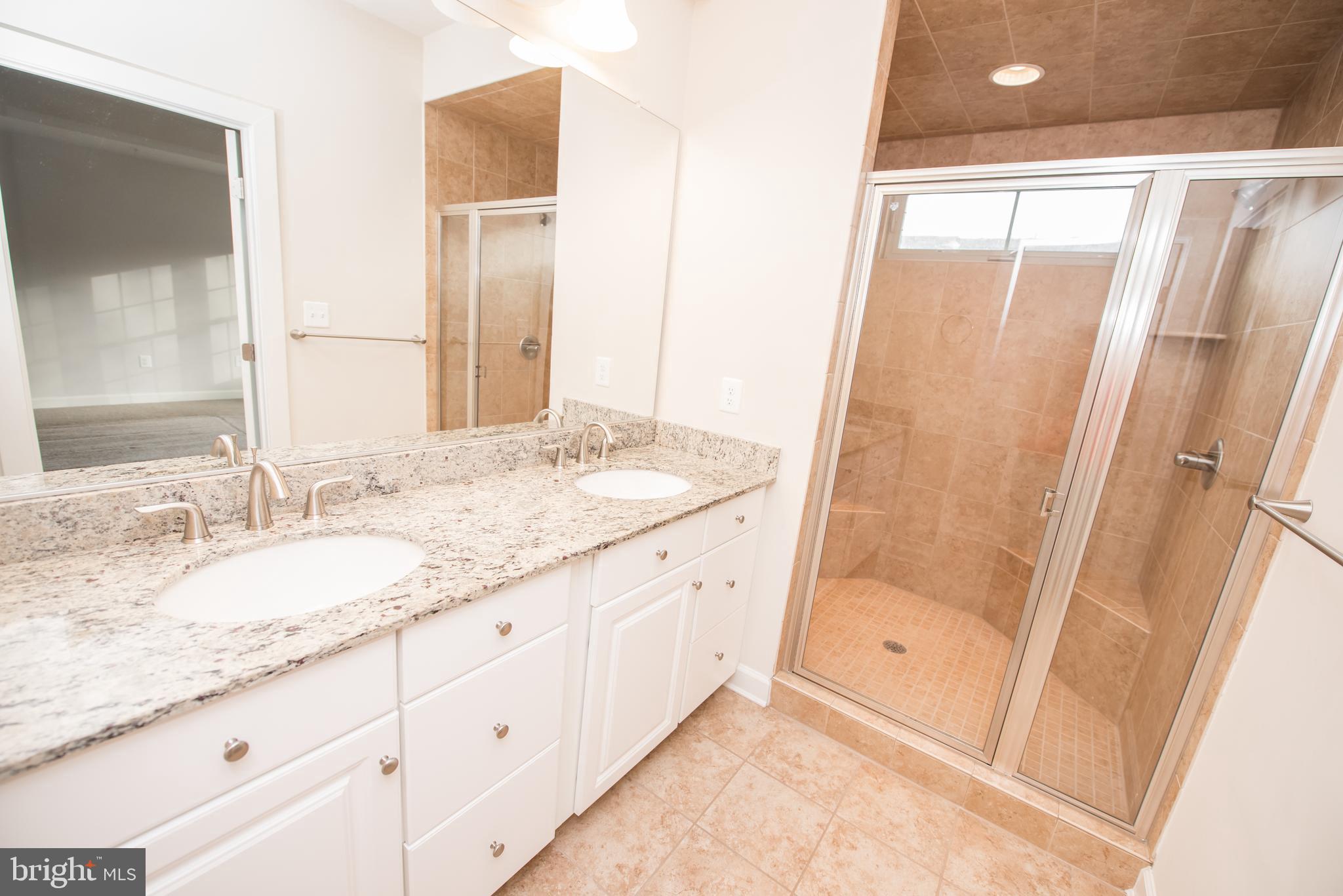 7444 Burnside Way Hanover, MD 21076 - Photo 24 of 46 a bathroom with a granite countertop sink and a mirror