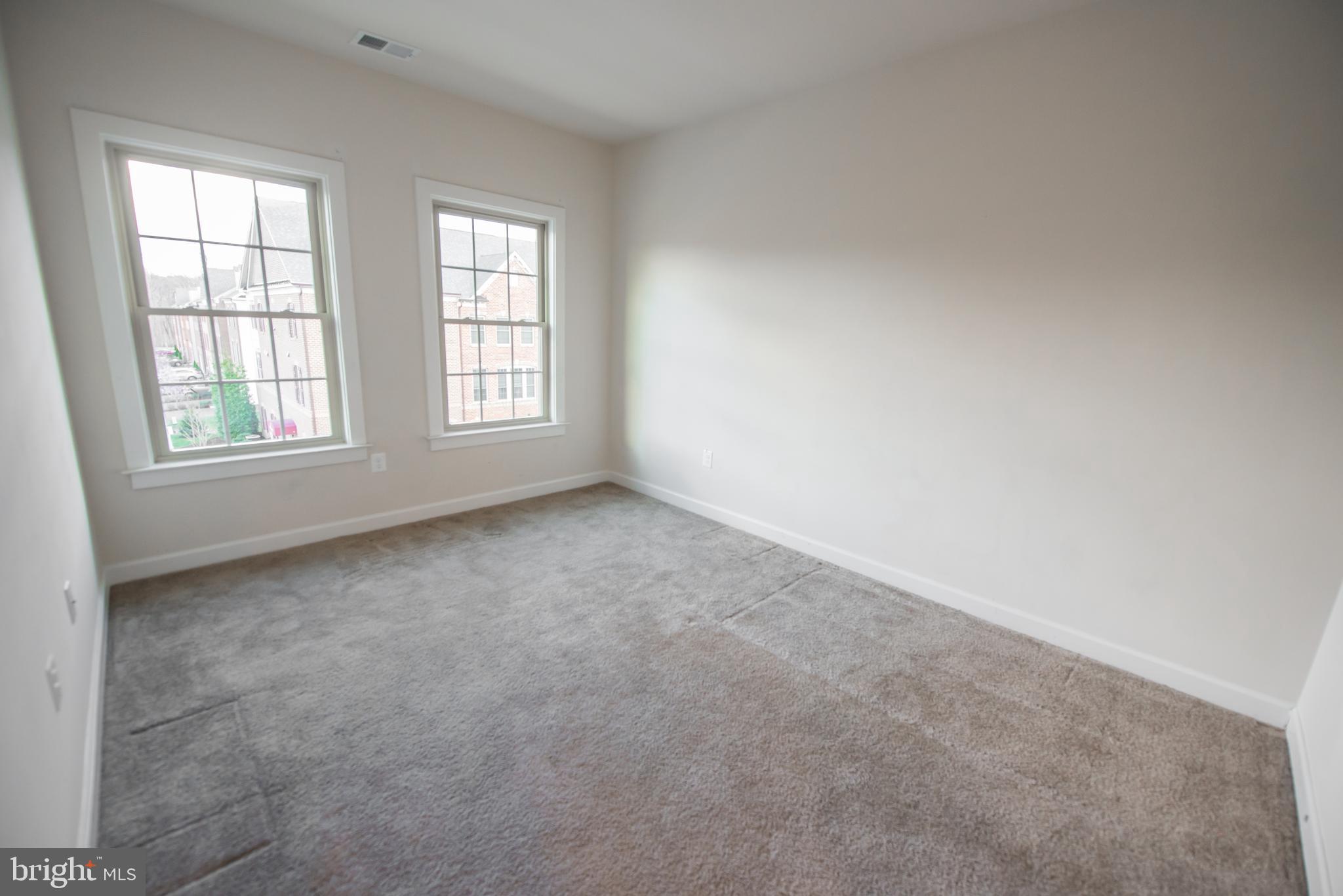 7444 Burnside Way Hanover, MD 21076 - Photo 35 of 46 an empty room with windows
