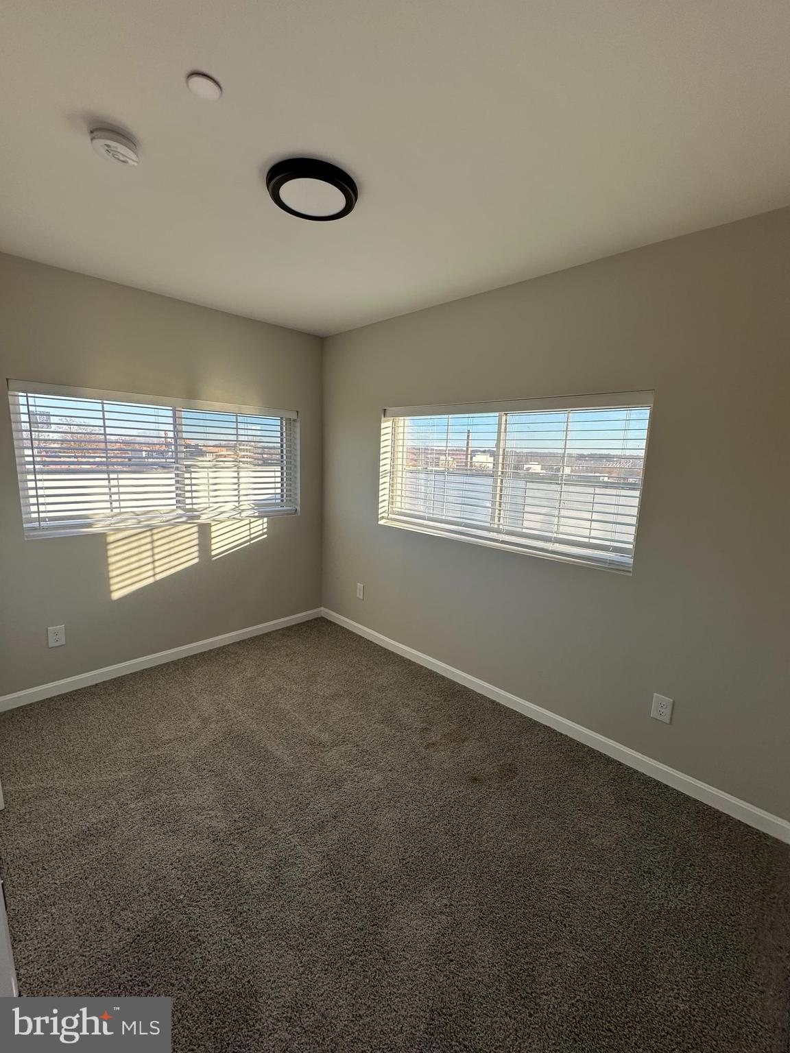 1812 H Place Northeast, Unit 409 Washington, DC 20002 - Photo 13 of 16 an empty room with window