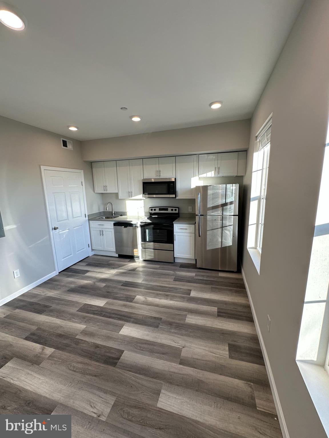 1812 H Place Northeast, Unit 409 Washington, DC 20002 - Photo 2 of 16 a view of kitchen and refrigerator