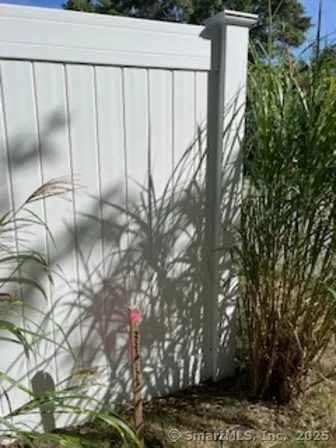 a view of a big yard with lots of green space