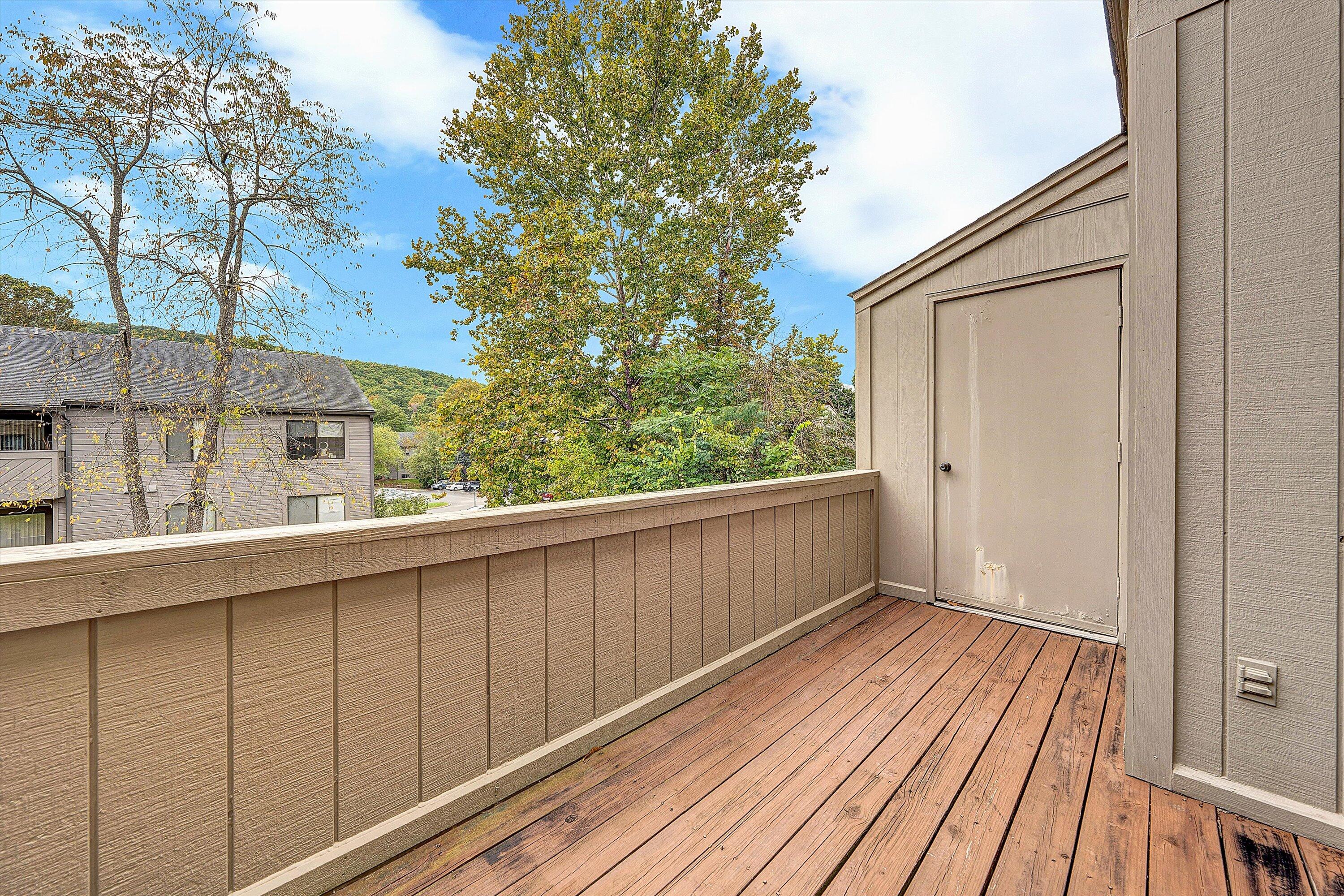 7313 Maple Court Southwest Roanoke, VA 24018 - Photo 15 of 38 a view of a balcony with wooden floor and fence