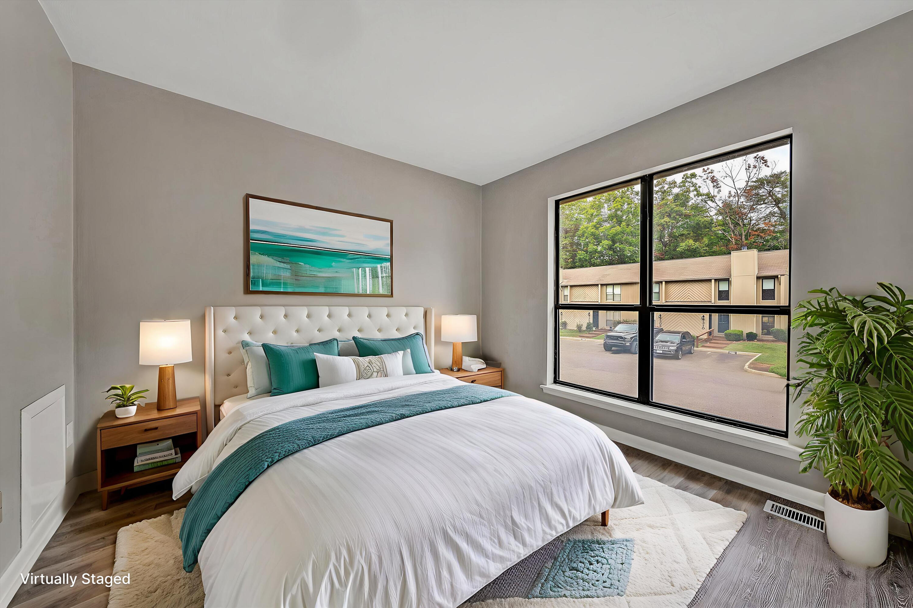 7313 Maple Court Southwest Roanoke, VA 24018 - Photo 19 of 38 a bedroom with a large bed and a potted plant