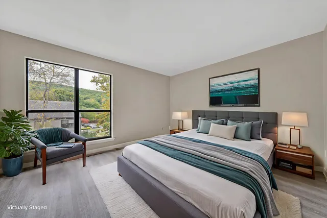 a bedroom with a bed and a couch