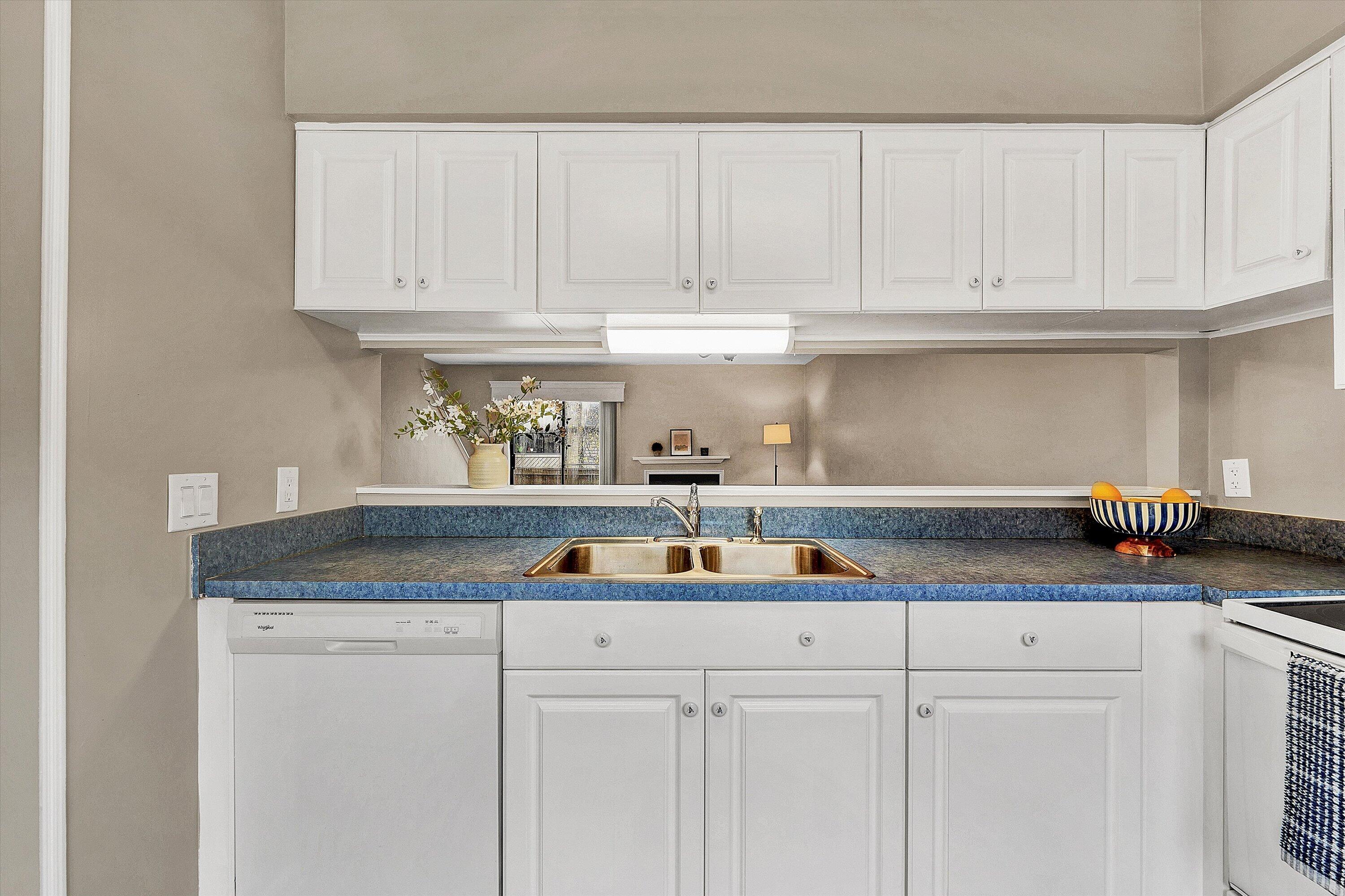 7313 Maple Court Southwest Roanoke, VA 24018 - Photo 8 of 38 a kitchen with white cabinets and a sink