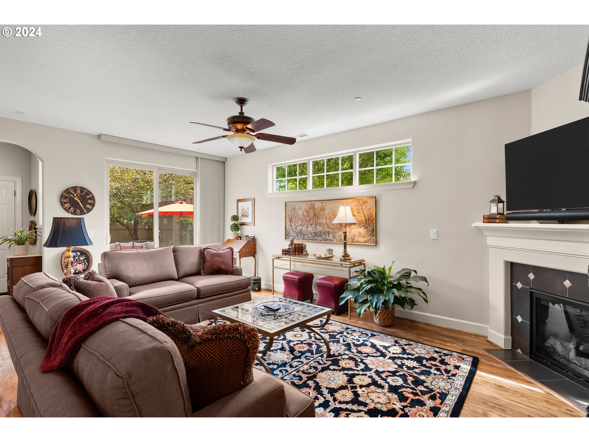29190 Southwest Serenity Way Wilsonville, OR 97070 - Photo 14 of 40 a living room with furniture and a fireplace
