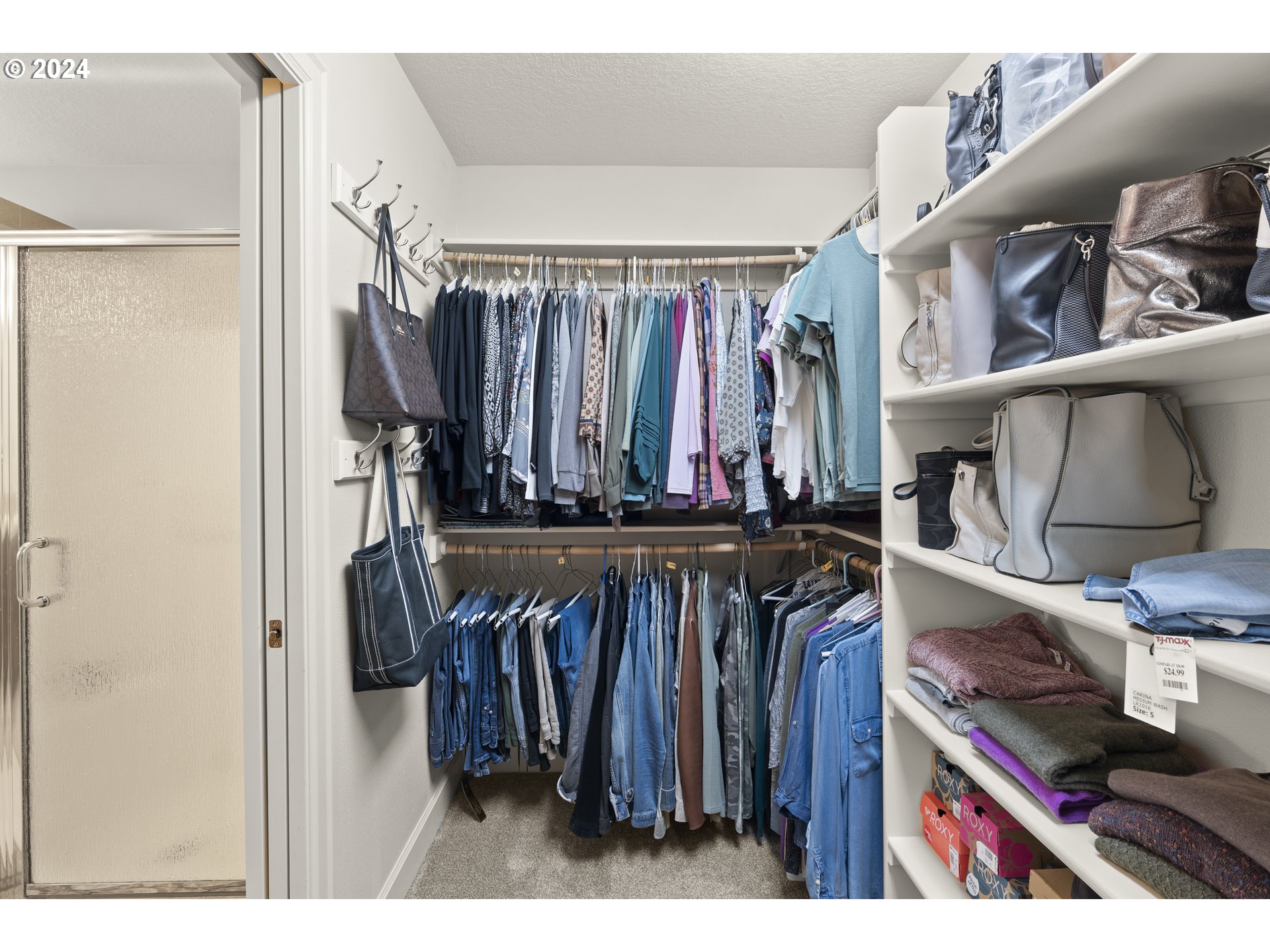29190 Southwest Serenity Way Wilsonville, OR 97070 - Photo 20 of 40 a view of walk in closet with clothes and shoes
