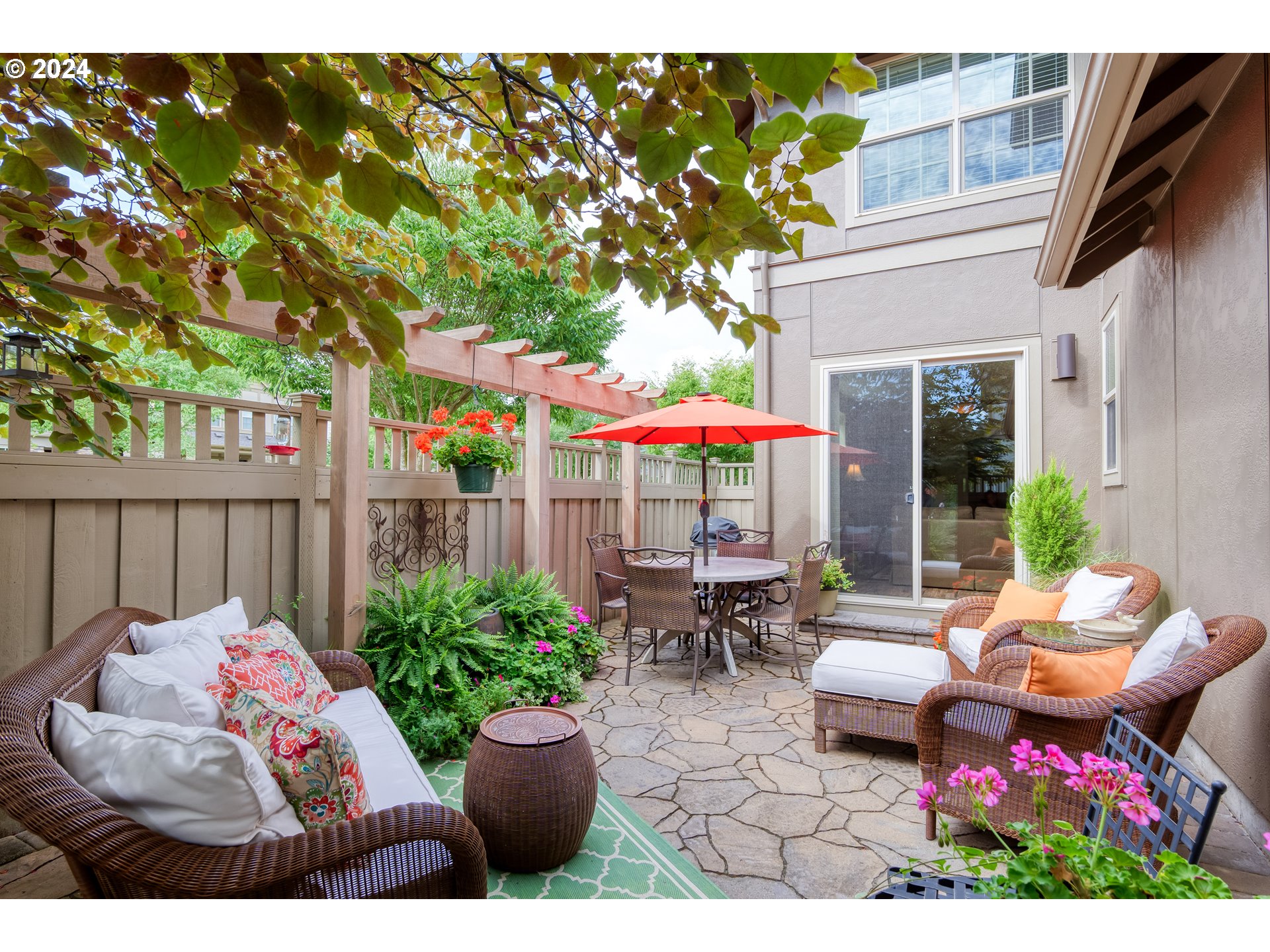 29190 Southwest Serenity Way Wilsonville, OR 97070 - Photo 29 of 40 a view of a patio with couches table and chairs and potted plants