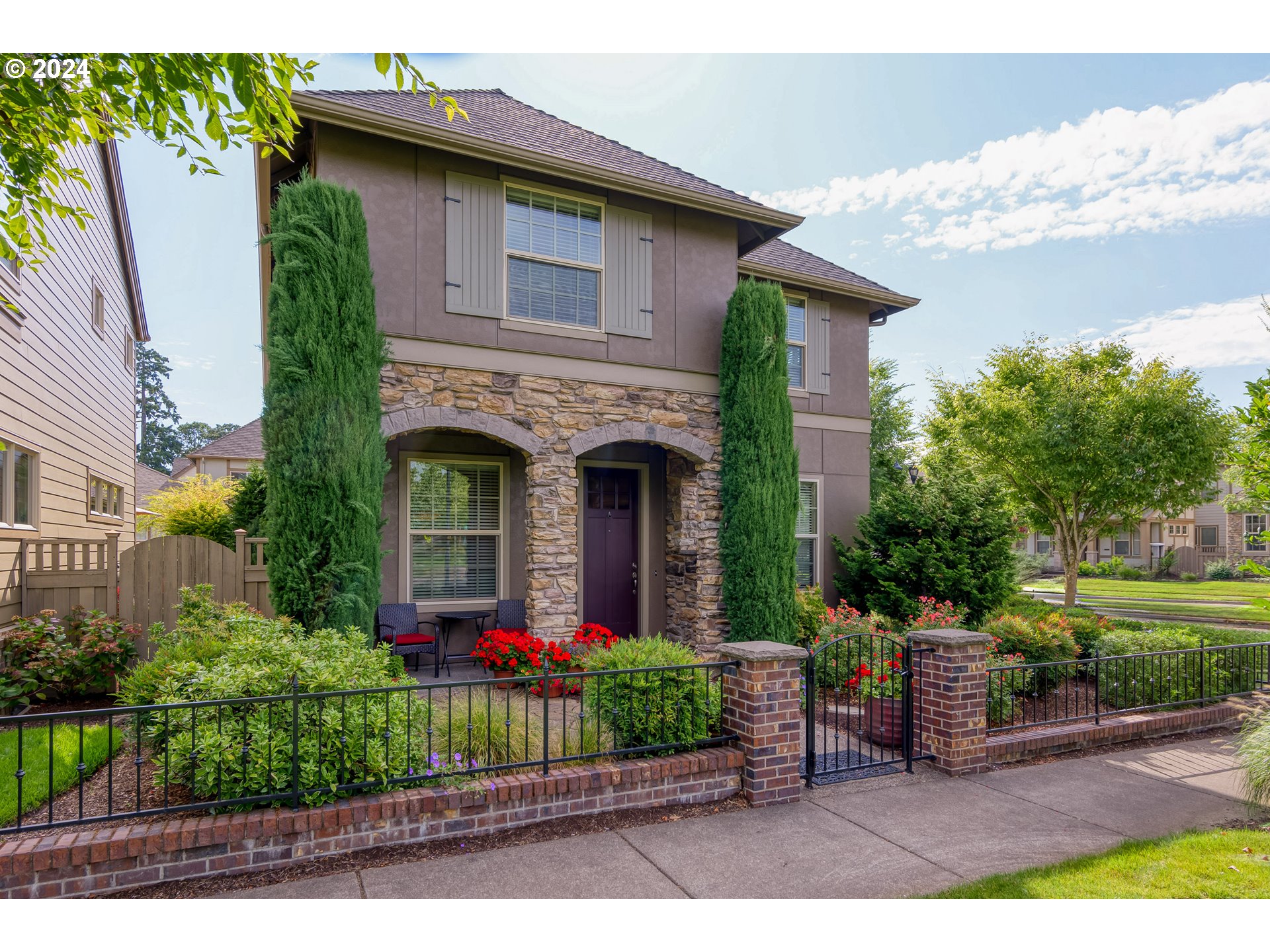 29190 Southwest Serenity Way Wilsonville, OR 97070 - Photo 3 of 40 a front view of a house with garden