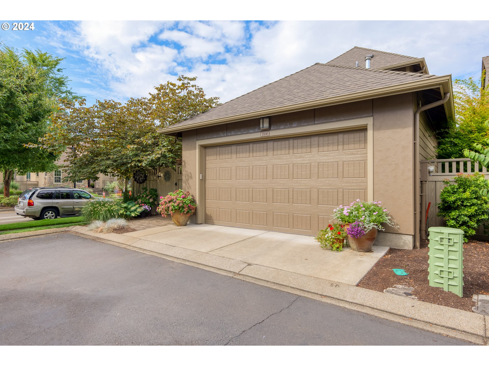 29190 Southwest Serenity Way Wilsonville, OR 97070 - Photo 31 of 40 a house view with a garden space