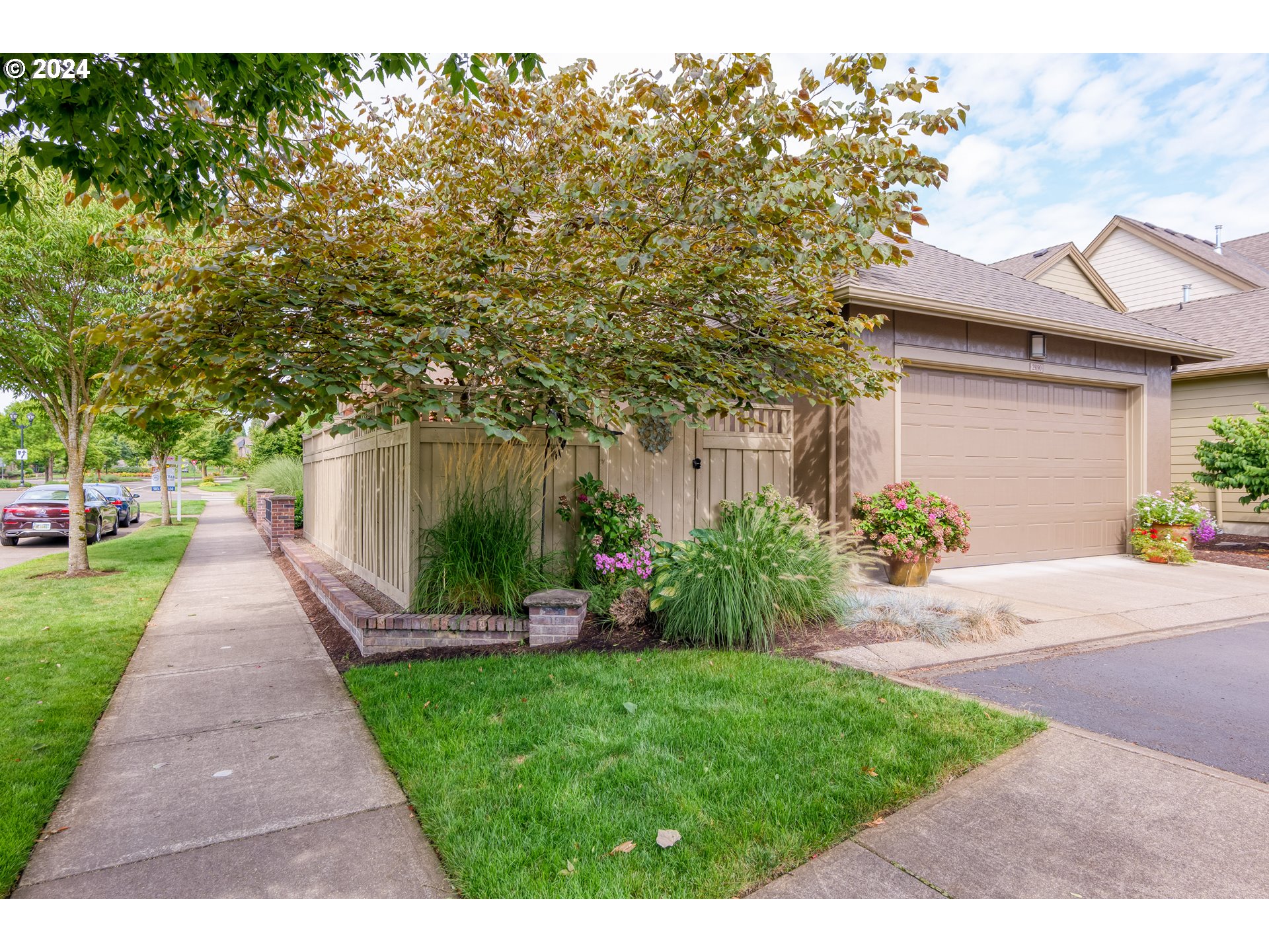29190 Southwest Serenity Way Wilsonville, OR 97070 - Photo 33 of 40 a front view of a house with a yard and potted plants
