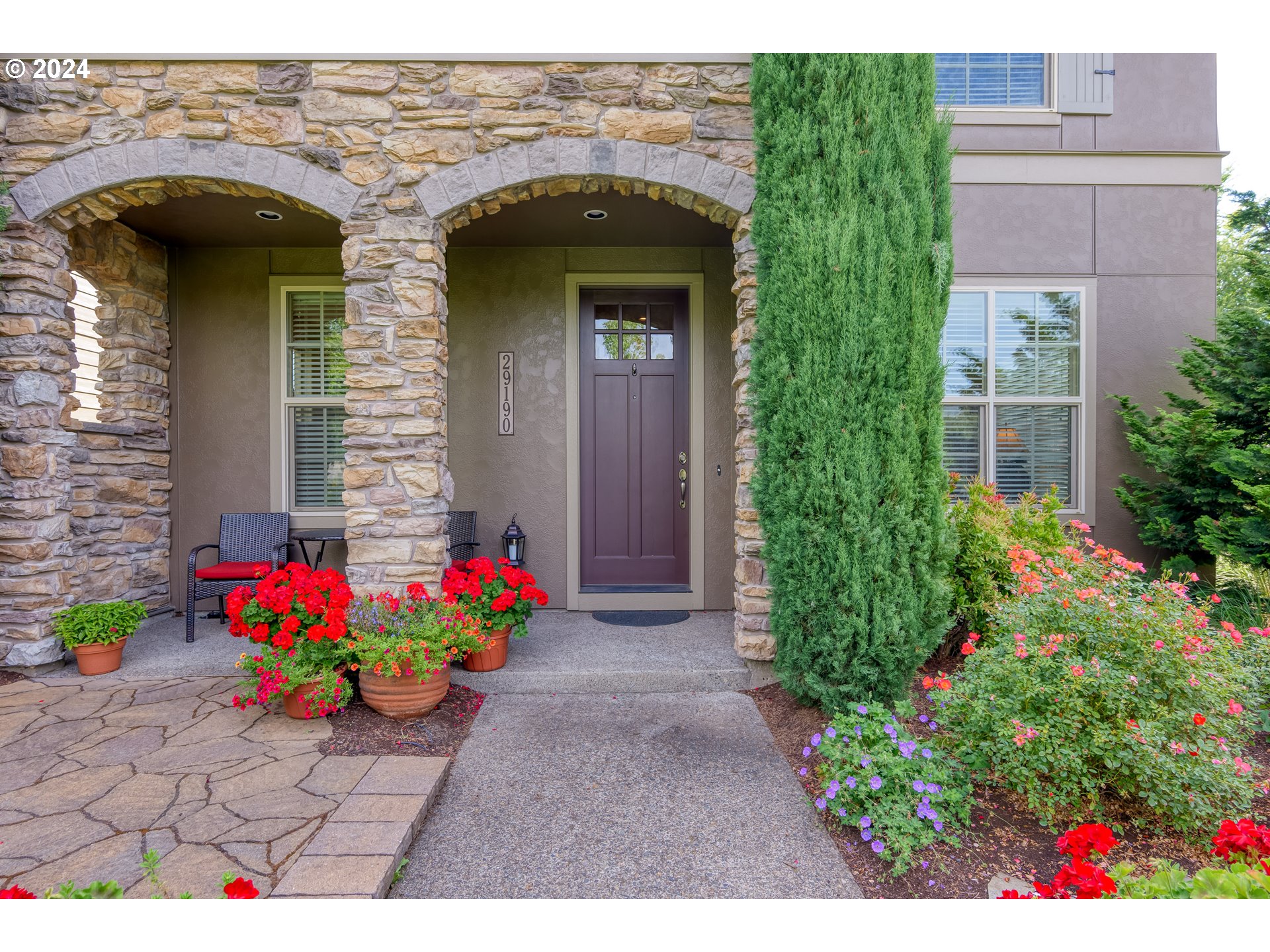 29190 Southwest Serenity Way Wilsonville, OR 97070 - Photo 4 of 40 a view of a house with potted plants