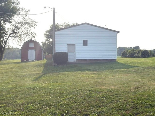 12666 South State Line Road Petersburg, OH 44454 - Photo 32 of 44 Side view of Tractor Building