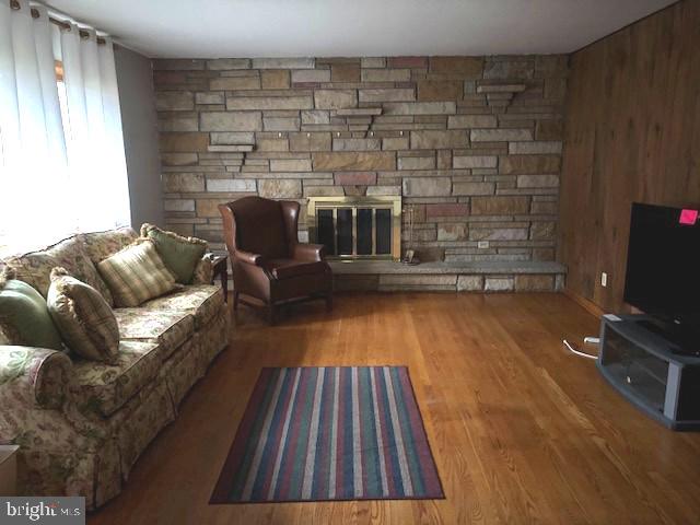 14804 Bell Street Southwest Cresaptown, MD 21502 - Photo 5 of 12 a living room with couches bookshelf and a flat screen tv