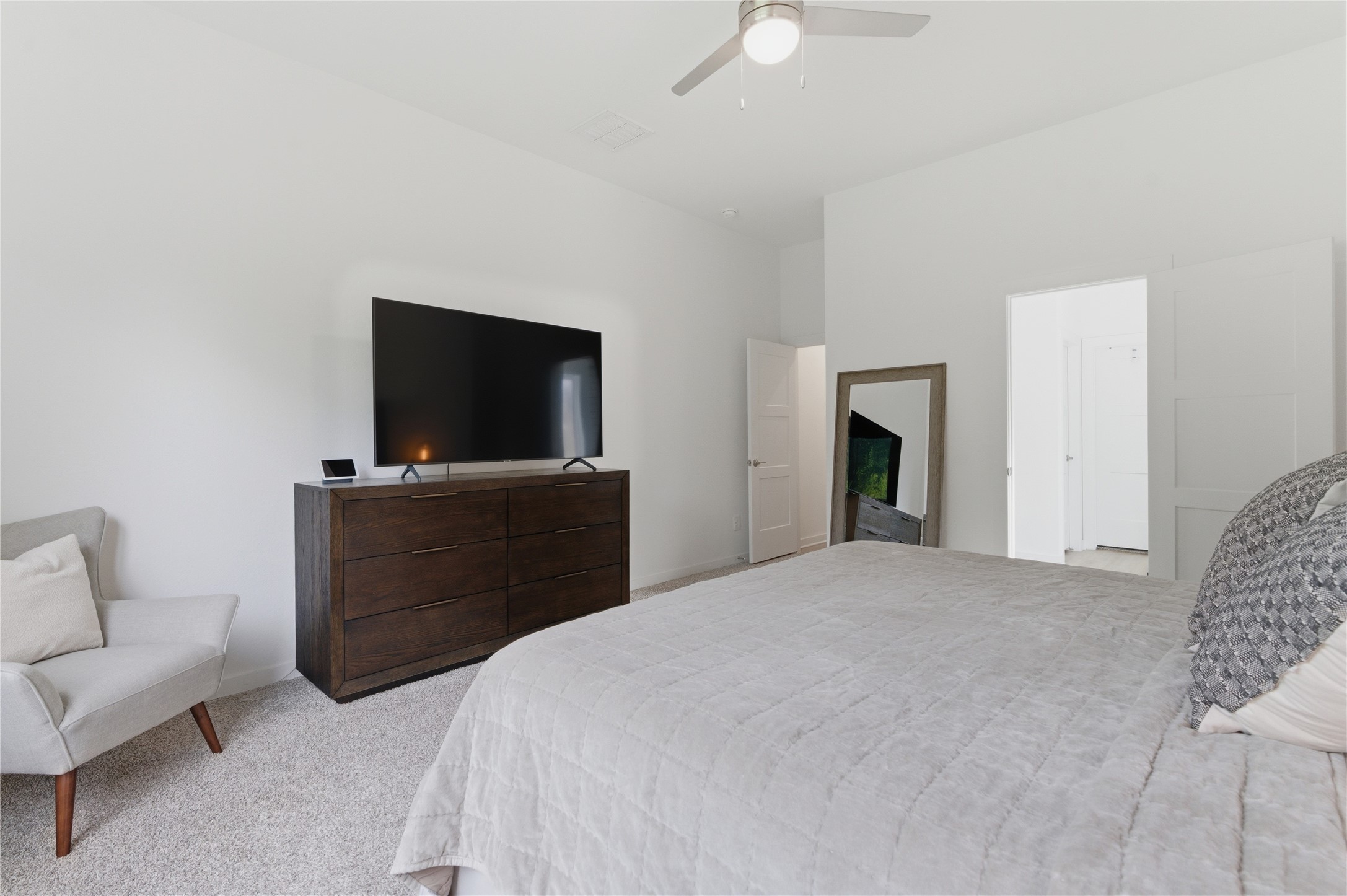 14108 Redfish Lake Conroe, TX 77384 - Photo 15 of 37 a bedroom with a bed and a flat screen tv
