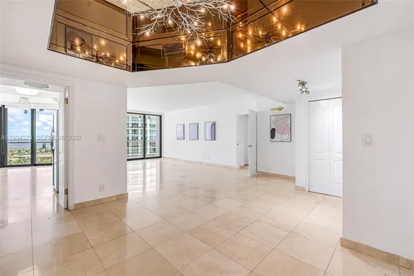a kitchen with stainless steel appliances granite countertop a sink and a stove