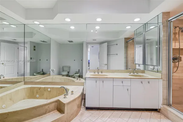a bathroom with a granite countertop sink mirror and shower