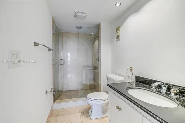 a view of bathroom with a sink and a mirror