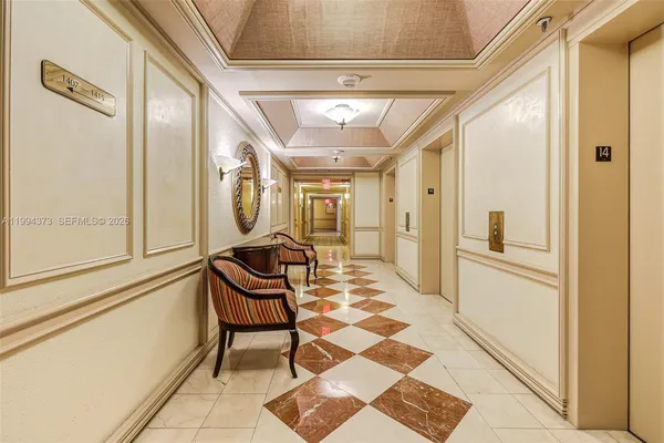 a living room with a rug and a table