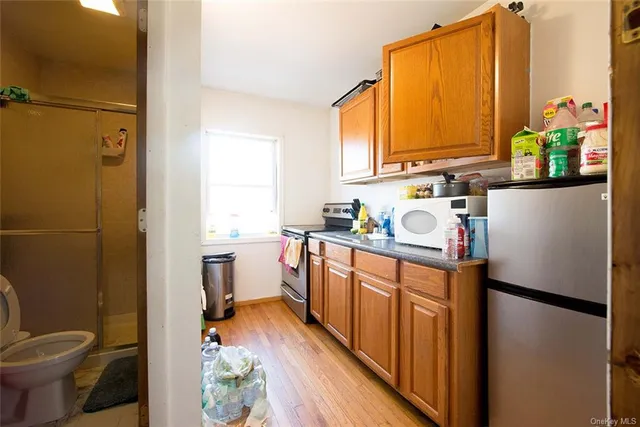 a kitchen with a refrigerator and sink