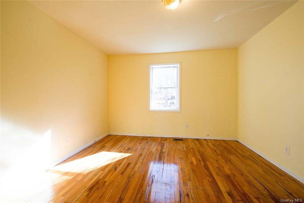 304 Wade Road Liberty, NY 12754 - Photo 19 of 35 a view of empty room with wooden floor