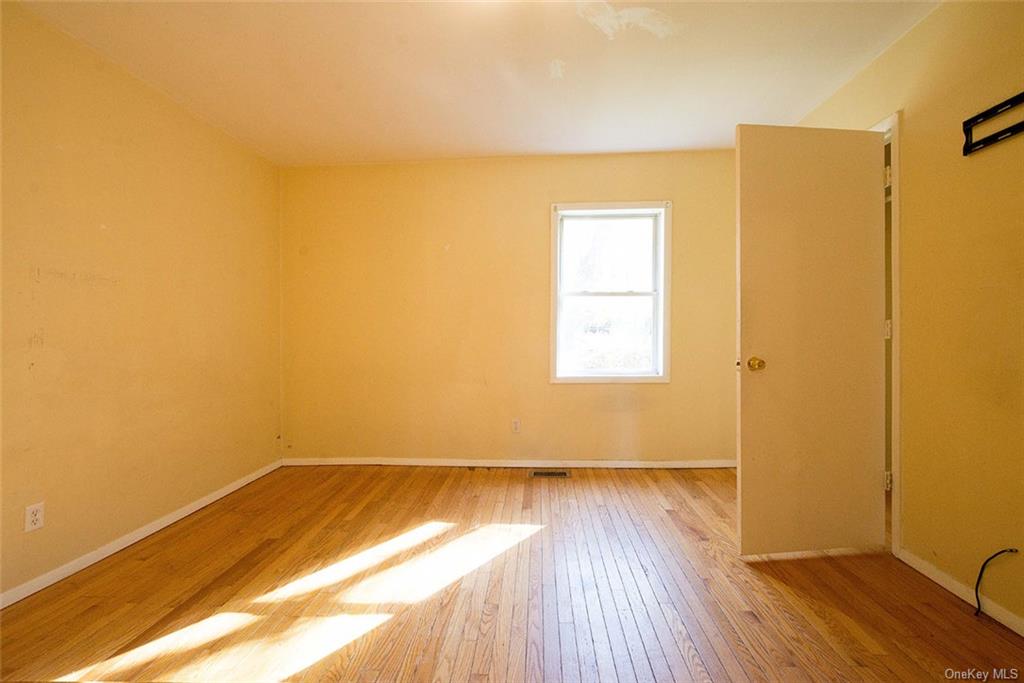 304 Wade Road Liberty, NY 12754 - Photo 22 of 35 a view of a room with wooden floor and a window