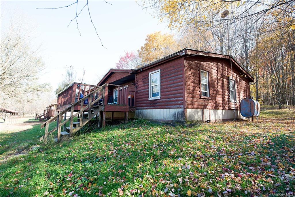 304 Wade Road Liberty, NY 12754 - Photo 30 of 35 a backyard of a house with lots of green space