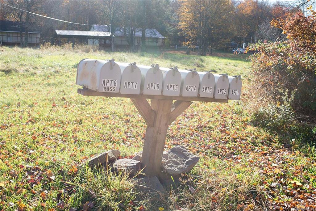 304 Wade Road Liberty, NY 12754 - Photo 3 of 35 a sign that is sitting on a brick wall