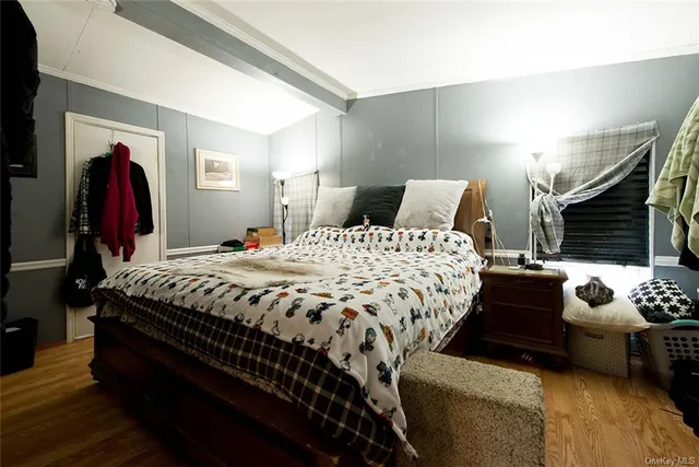 a bedroom with bed and a couch