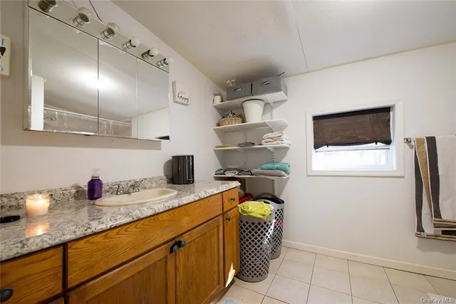 a kitchen with sink cabinets and window