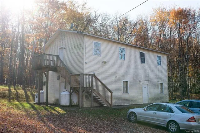 a house view with a backyard space