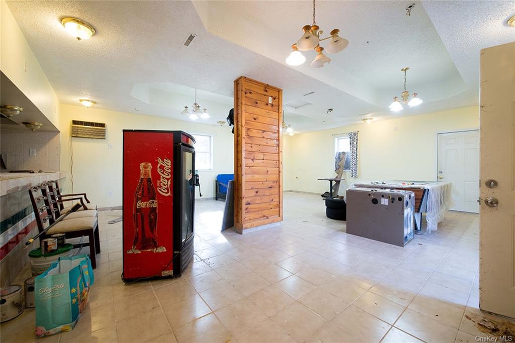 304 Wade Road Liberty, NY 12754 - Photo 5 of 35 a living room with furniture and a flat screen tv