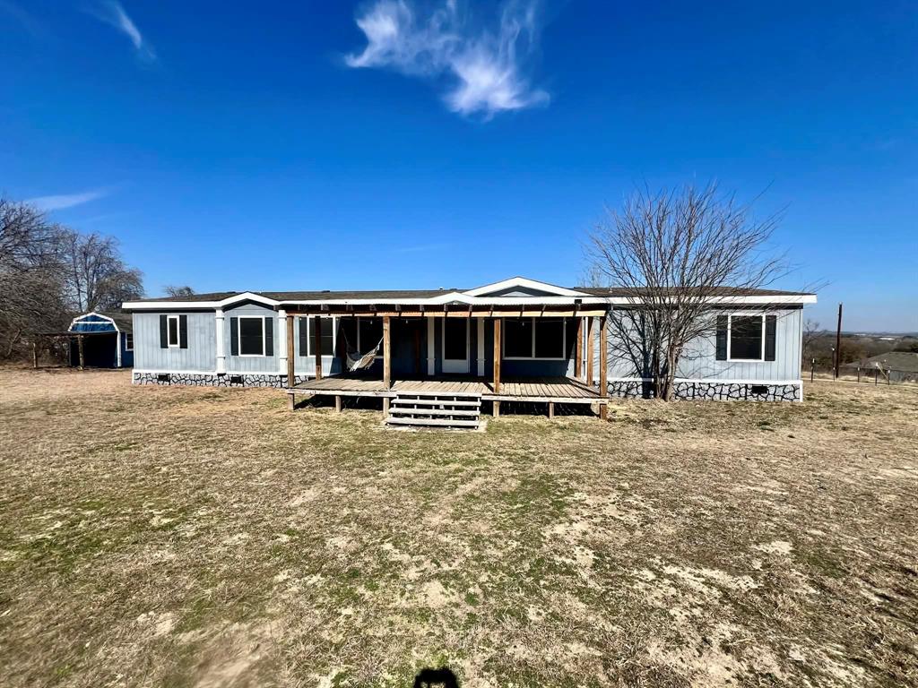 1085 Highland Circle Springtown, TX 76082 - Photo 1 of 30 a front view of a house with a yard