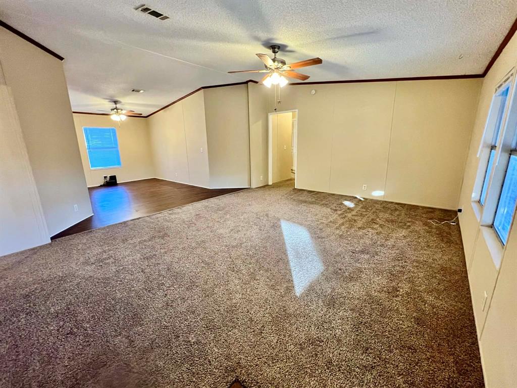 1085 Highland Circle Springtown, TX 76082 - Photo 4 of 30 a view of a room with wooden floor and staircase