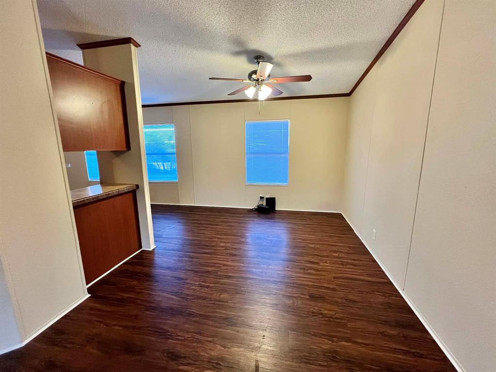 1085 Highland Circle Springtown, TX 76082 - Photo 5 of 30 a view of a livingroom with wooden floor