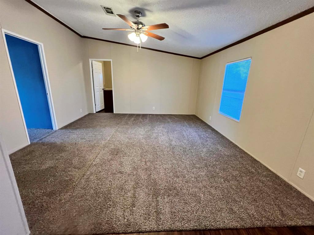 1085 Highland Circle Springtown, TX 76082 - Photo 6 of 30 a view of an empty room with a window