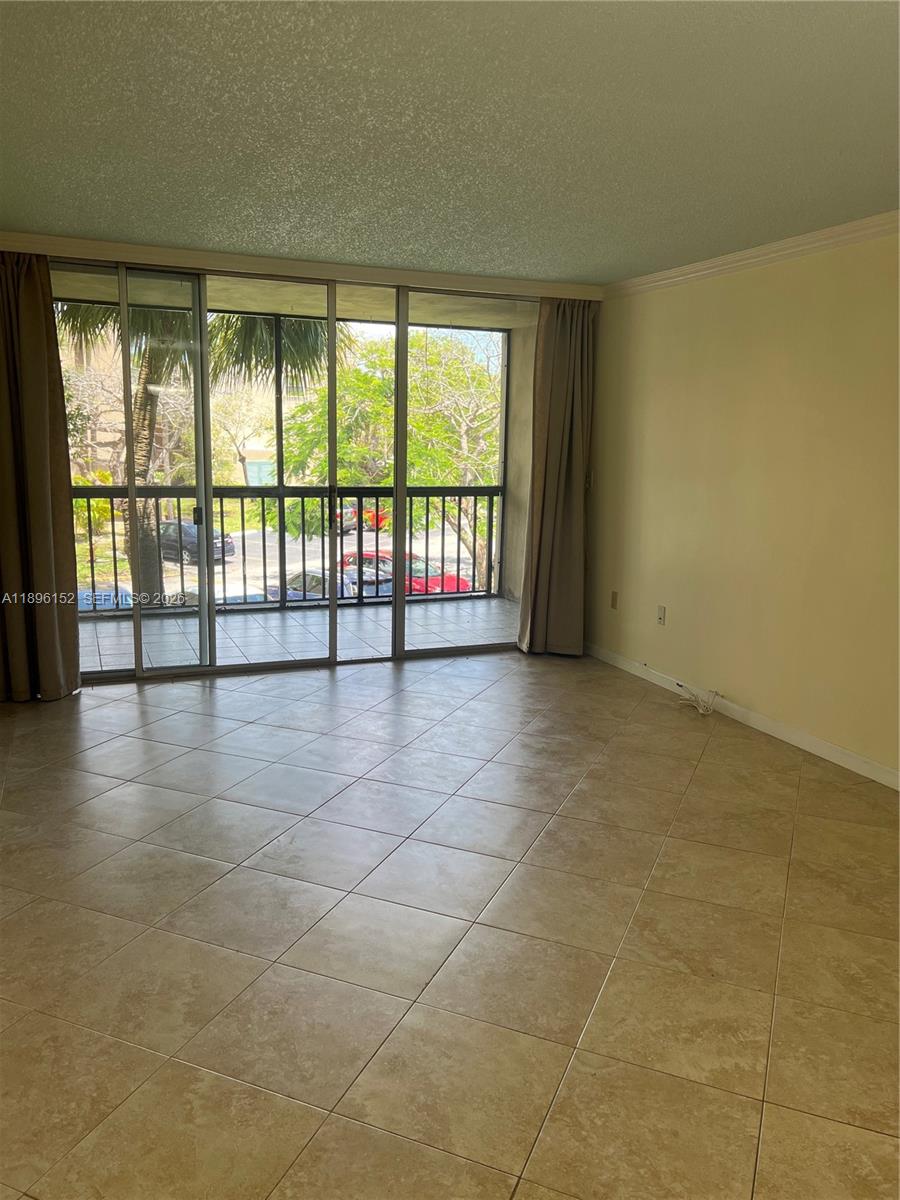10855 Southwest 112th Avenue, Unit 215 Miami, FL 33176 - Photo 12 of 45 a view of an empty room and window