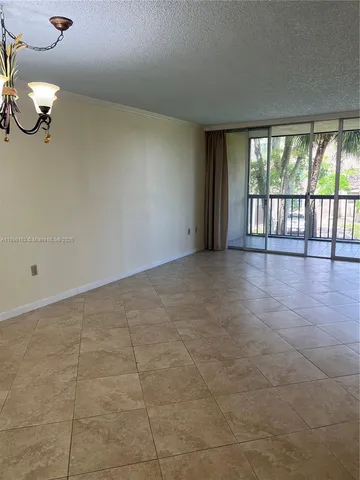 a view of a room with cabinet and windows