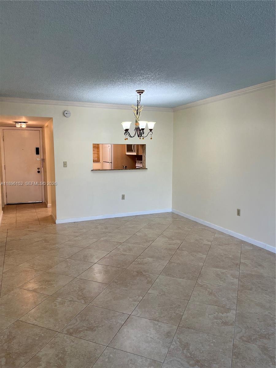 10855 Southwest 112th Avenue, Unit 215 Miami, FL 33176 - Photo 15 of 45 a view of a room with cabinet and windows
